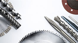 Various Bosch Professional tools are lying on a white background.