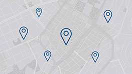 A map with white areas and blue location markers.