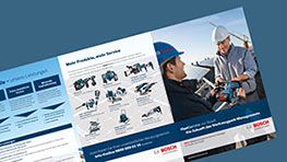 Two men are checking Bosch Professional tools in a catalog.