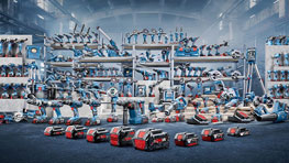 Various Bosch Professional tools on shelves and the floor.