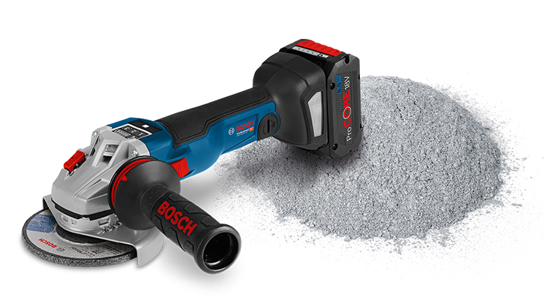 +30 A blue Bosch Professional angle grinder is lying next to gray dust.
