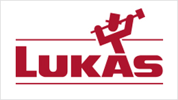 Logo of Lukas with red lettering and a figure with a hammer.